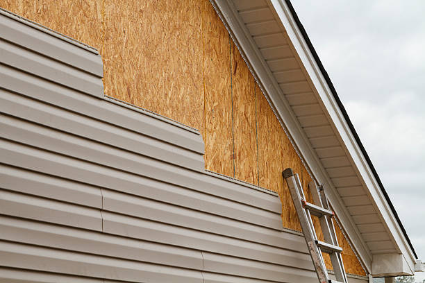 Professional Siding Contractor technician working in Wheaton, MD